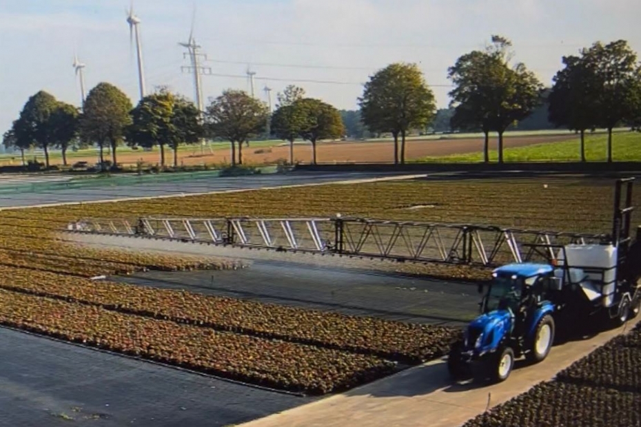 De spuitarm in het veld
